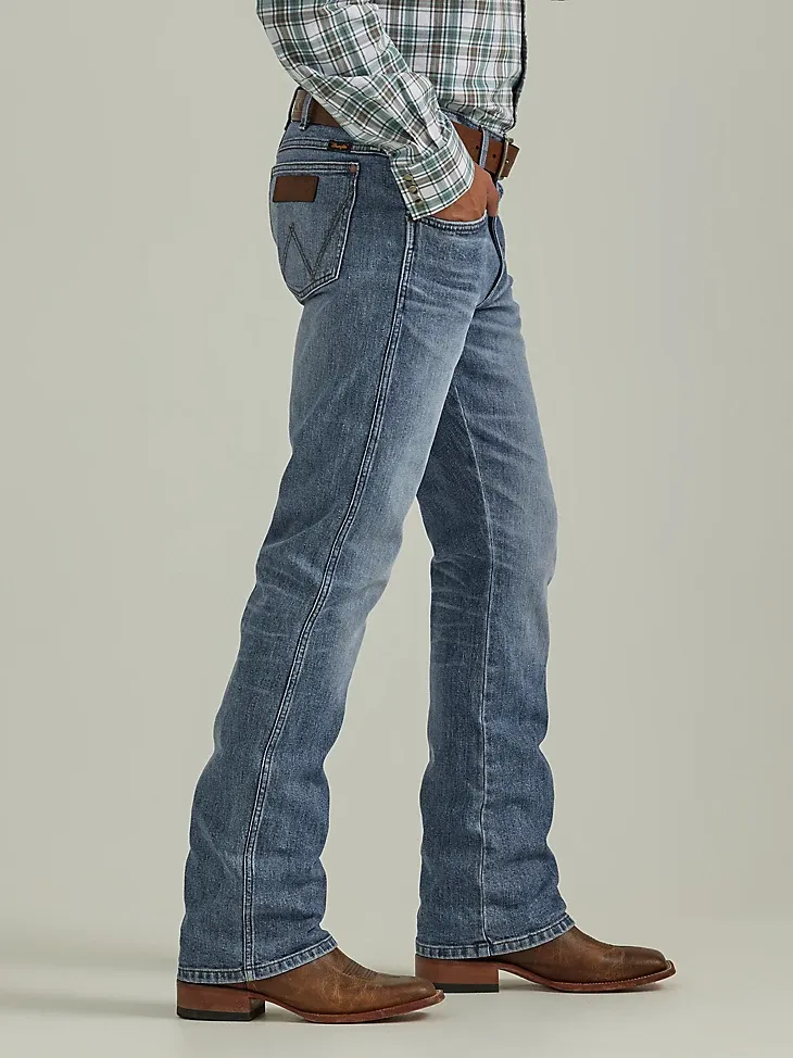 THE WRANGLER RETRO® PREMIUM JEAN: MEN'S SLIM BOOT IN WILD WEST