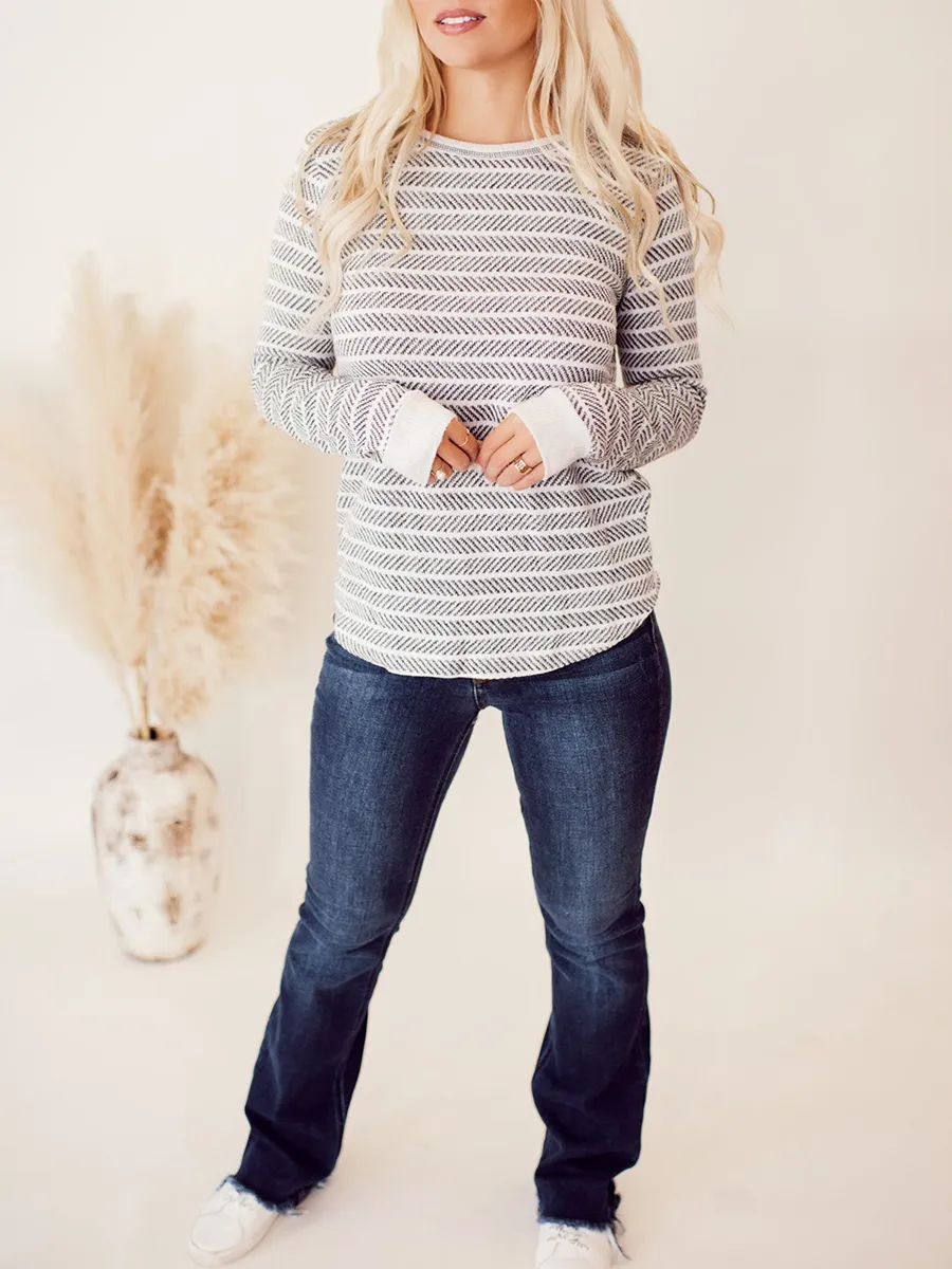 Ivory and dark gray herringbone pattern knitted sweater