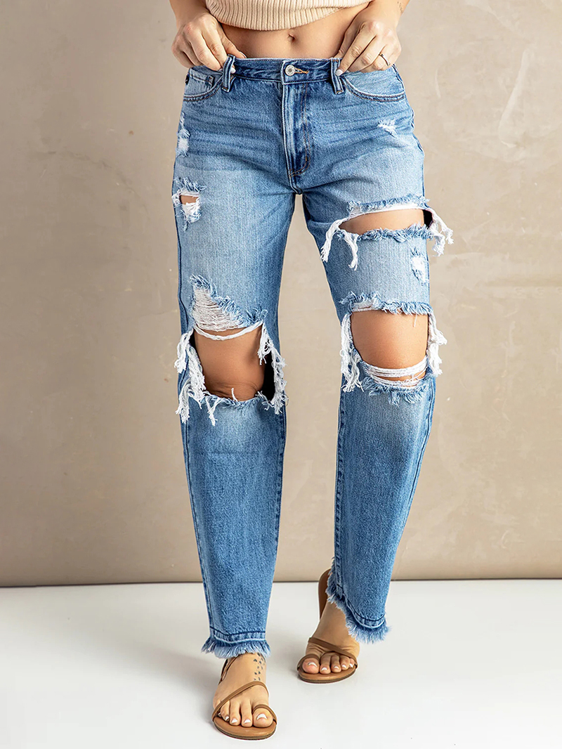 Women's washed ripped fringed jeans